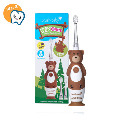 Brown and White Bernie Bear WildOnes sonic toothbrush in front of packaging for young children